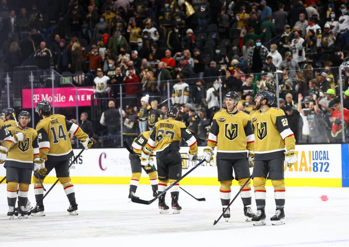 The Golden Knights celebrate after defeating the Minnesota Wild in an NHL hockey game at T-Mobi ...