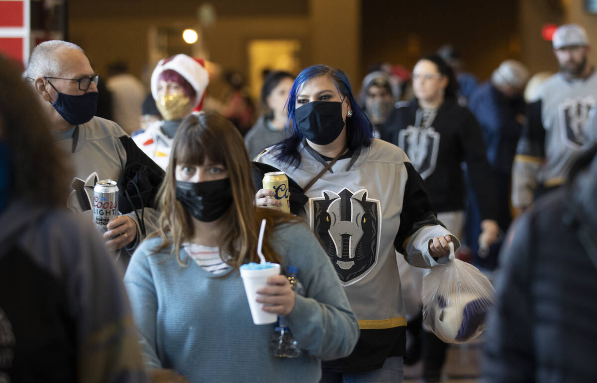 Fans bring stuffed animals to throw on the ice after the first Silver Knights goal during the & ...