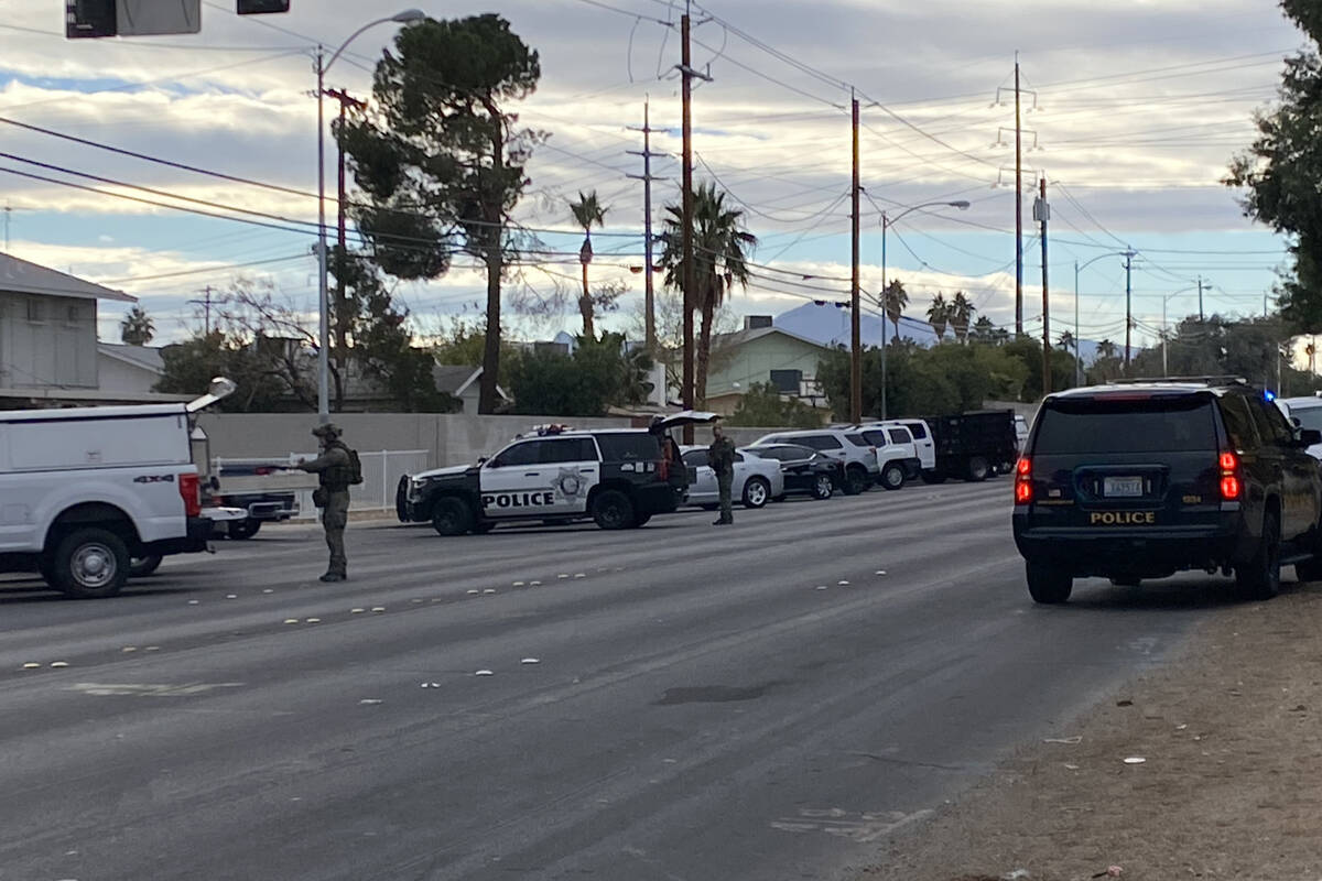 Las Vegas police, including a SWAT unit respond to a neighborhood near a middle school in south ...