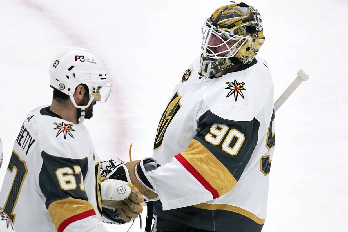 Vegas Golden Knights goaltender Robin Lehner (90) is congratulated by Max Pacioretty (67) after ...