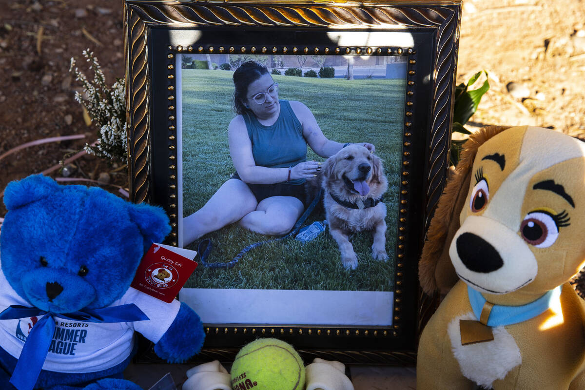 A photograph of Tina Tintor, 23, and her dog is placed at a makeshift memorial site to honor th ...