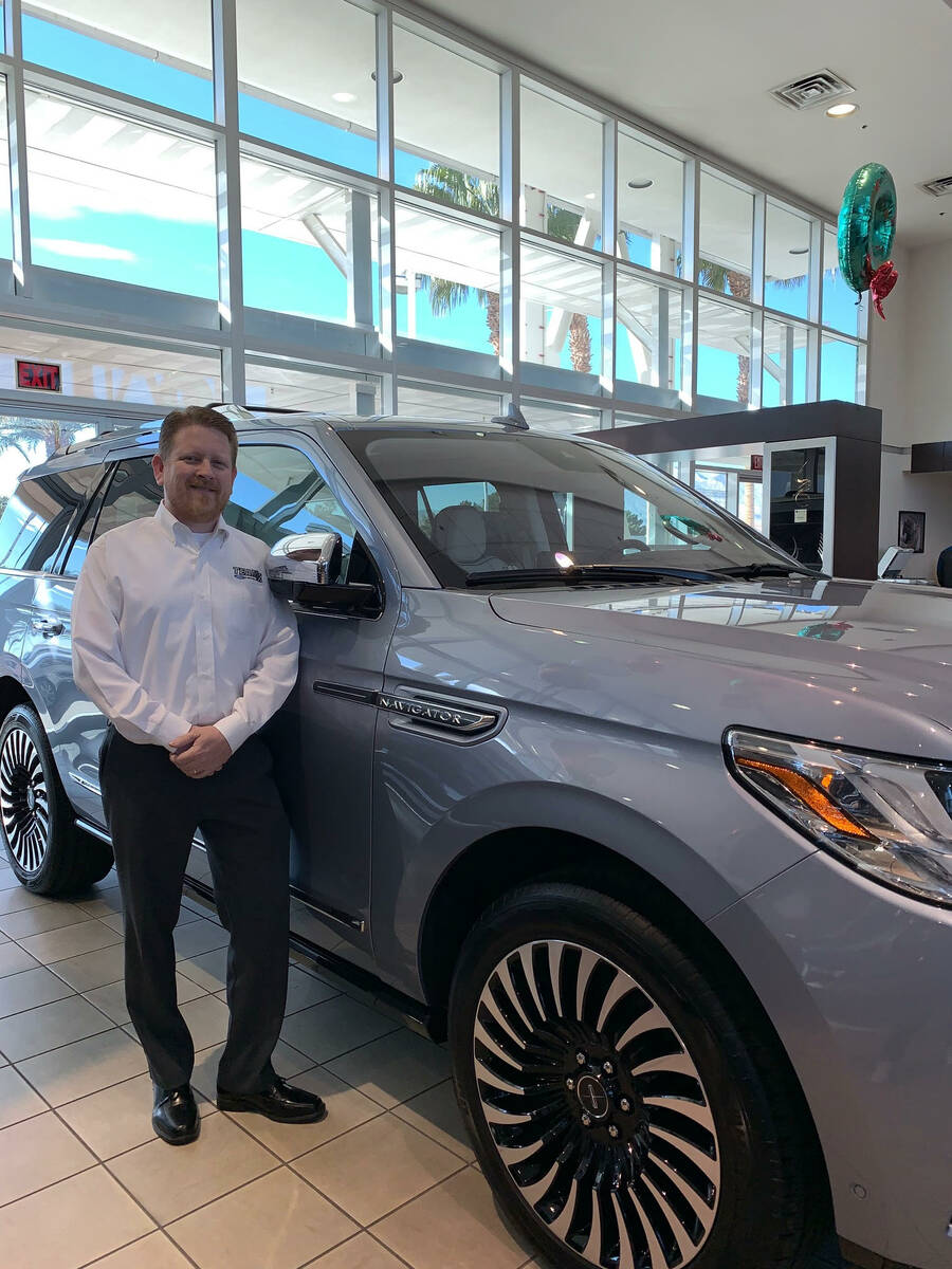 Lincoln Brand Manager Bill Jenkins stands next to the popular Navigator at the Team Lincoln sho ...