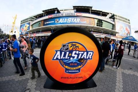 A giant hockey puck is part of Thunder Alley area during the NHL All-Star fan fest outside Amal ...