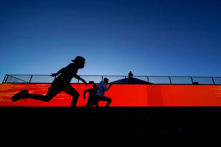 Football fans run the 40-yard dash at the NFL Experience for Super Bowl LV Friday, Jan. 29, 202 ...