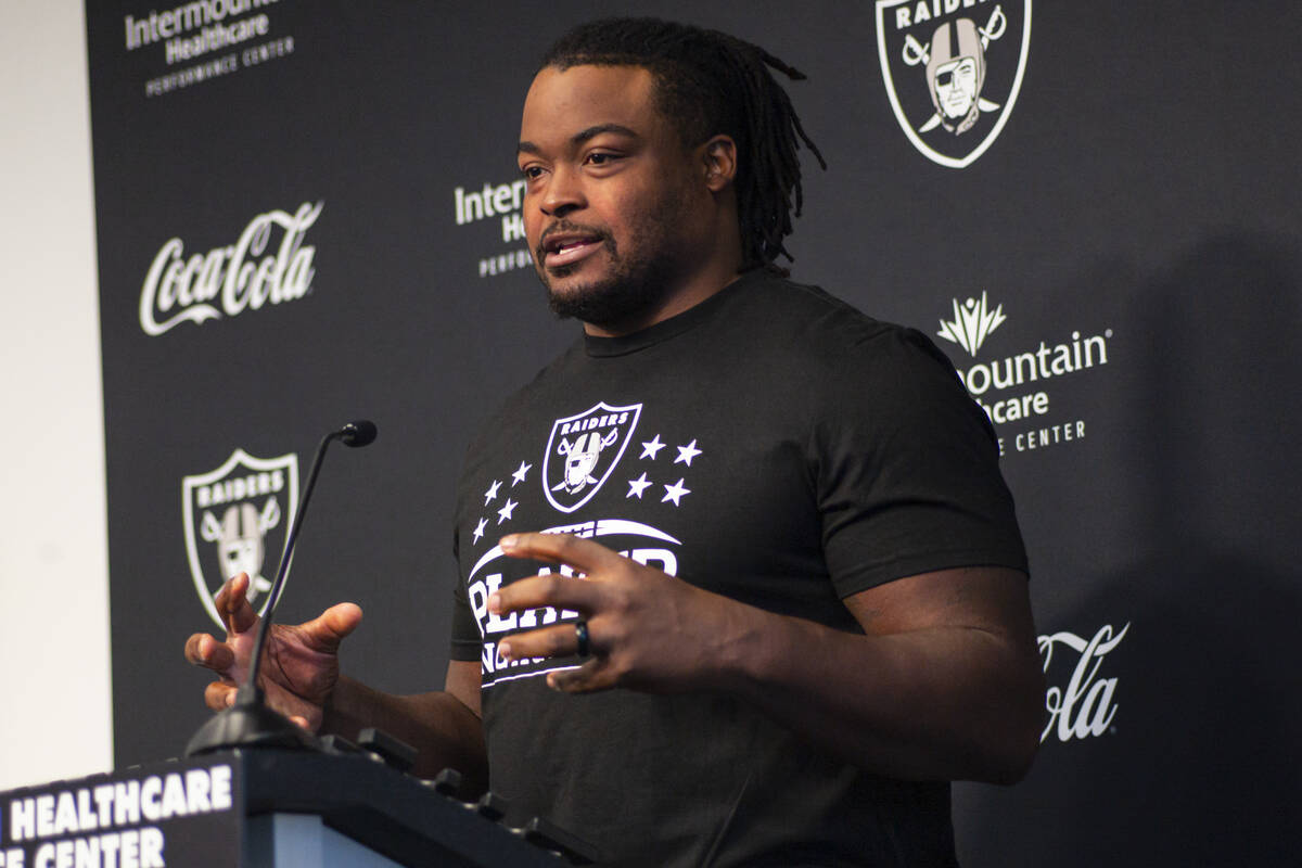 Raiders offensive guard John Simpson responds to questions during training camp at Raiders Head ...
