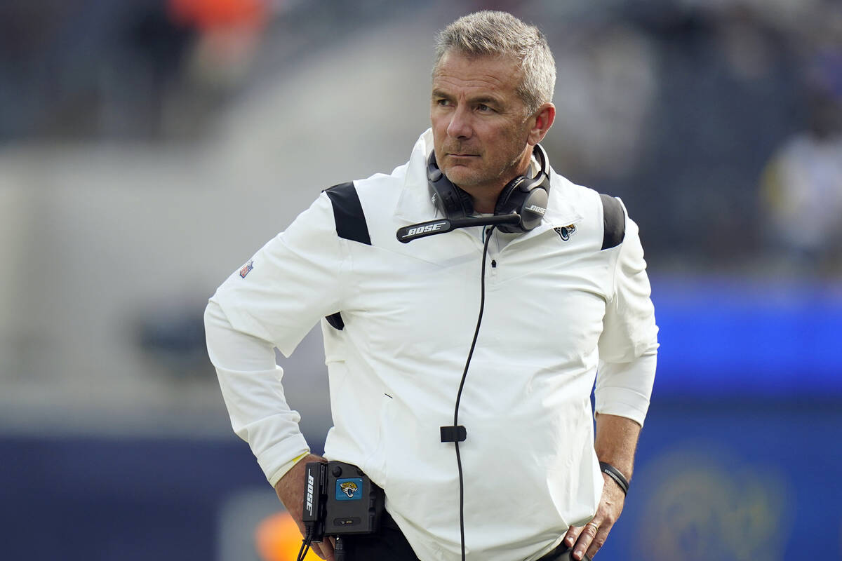 Jacksonville Jaguars head coach Urban Meyer stands on the field before an NFL football game aga ...