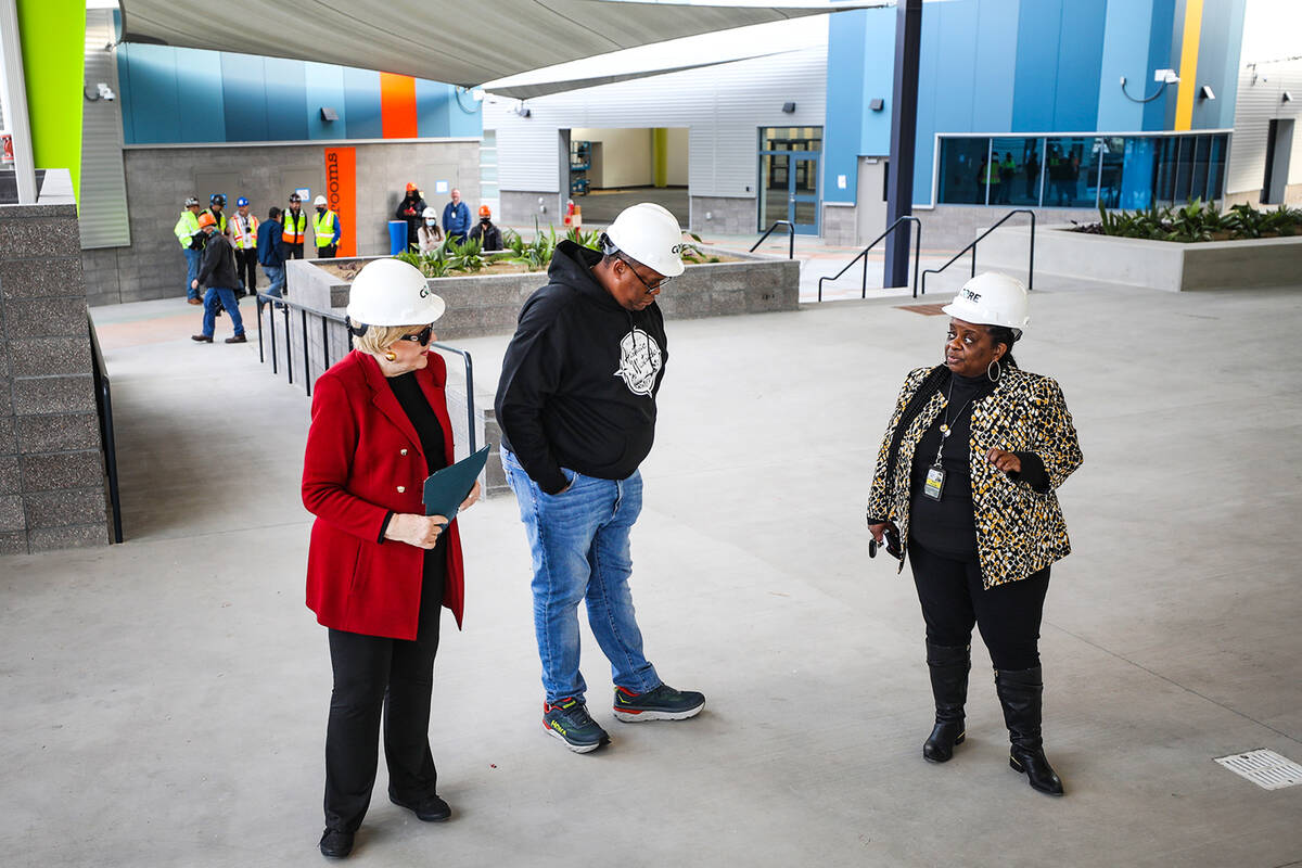 Kathi Thomas, director of community services for the city of Las Vegas, right, leads a tour for ...