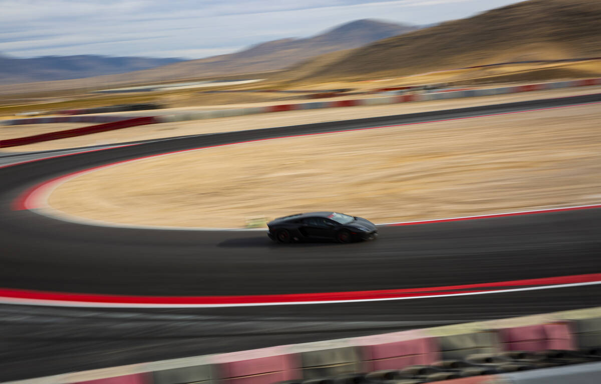 A Lamborghini Aventador moves along the track at Exotics Racing at SpeedVegas Motorsports Park ...