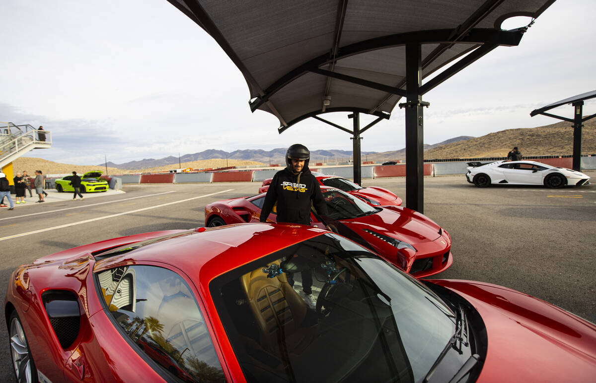 Romain Thievin, co-founder and co-CEO of Exotics Racing, opens the door of a Ferrari 488 GTB at ...