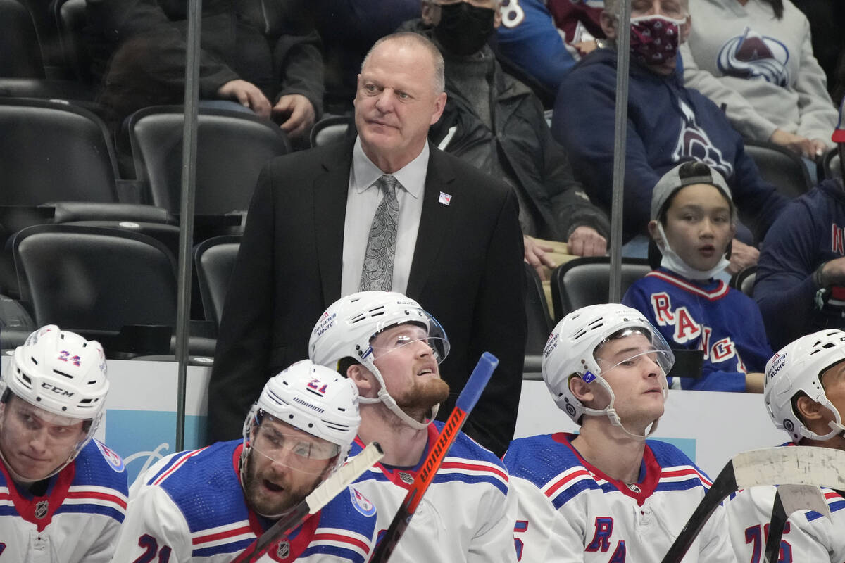 New York Rangers head coach Gerard,r ear, Gallant looks on during the second period of an NHL h ...