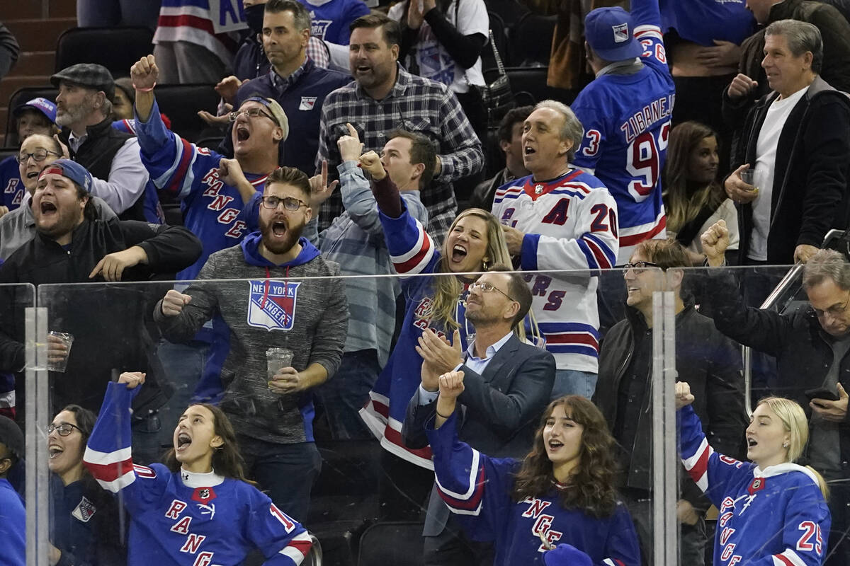 New York Rangers fans celebrate a goal by left wing Chris Kreider during the second period of a ...