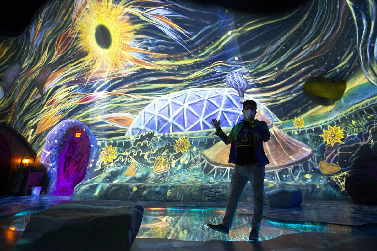 Corvas Brinkerhoff, executive creative director of Meow Wolf Las Vegas, explains a projected de ...