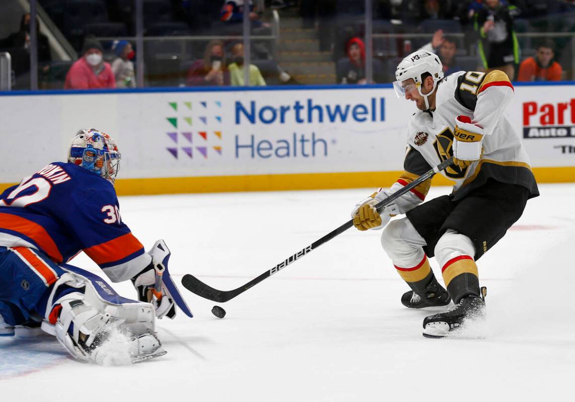 Vegas Golden Knights' Nicolas Roy (10) scores the winning penalty shot past New York Islanders' ...