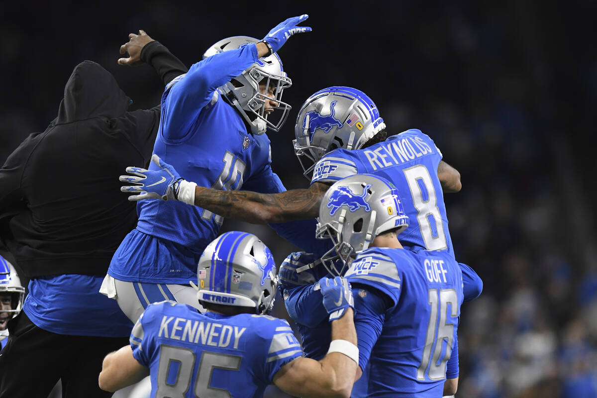 Teammates congratulate Detroit Lions wide receiver Josh Reynolds (8) after his touchdown during ...