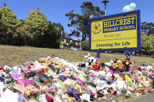Flowers and tributes are seen outside Hillcrest Primary School in Devonport, in the island stat ...