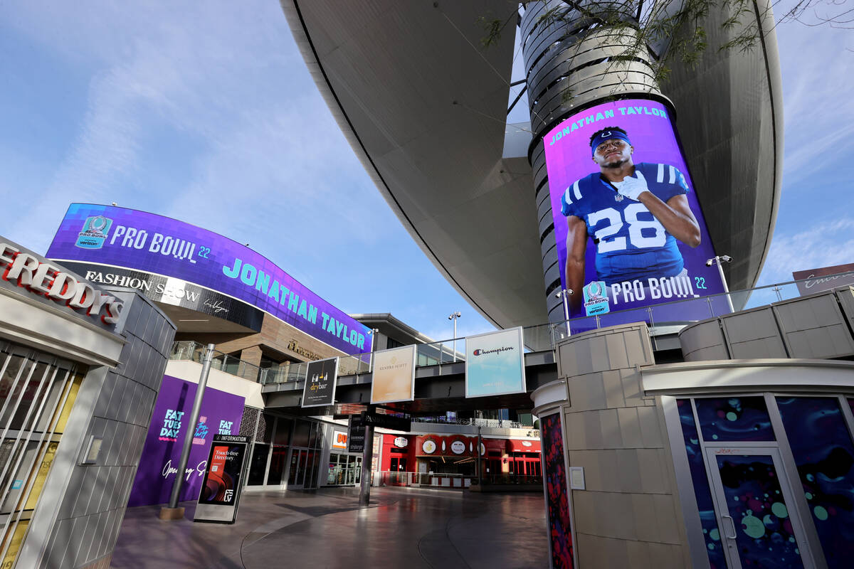 Pro Bowl pick, Indianapolis Colts running back Jonathan Taylor, is displayed on video screens a ...