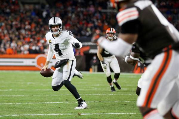 Raiders quarterback Derek Carr (4) looks for an open pass during the first half of an NFL footb ...