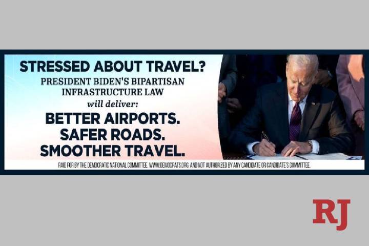 A billboard paid for by the Democratic National Committee and featuring President Joe Biden sig ...