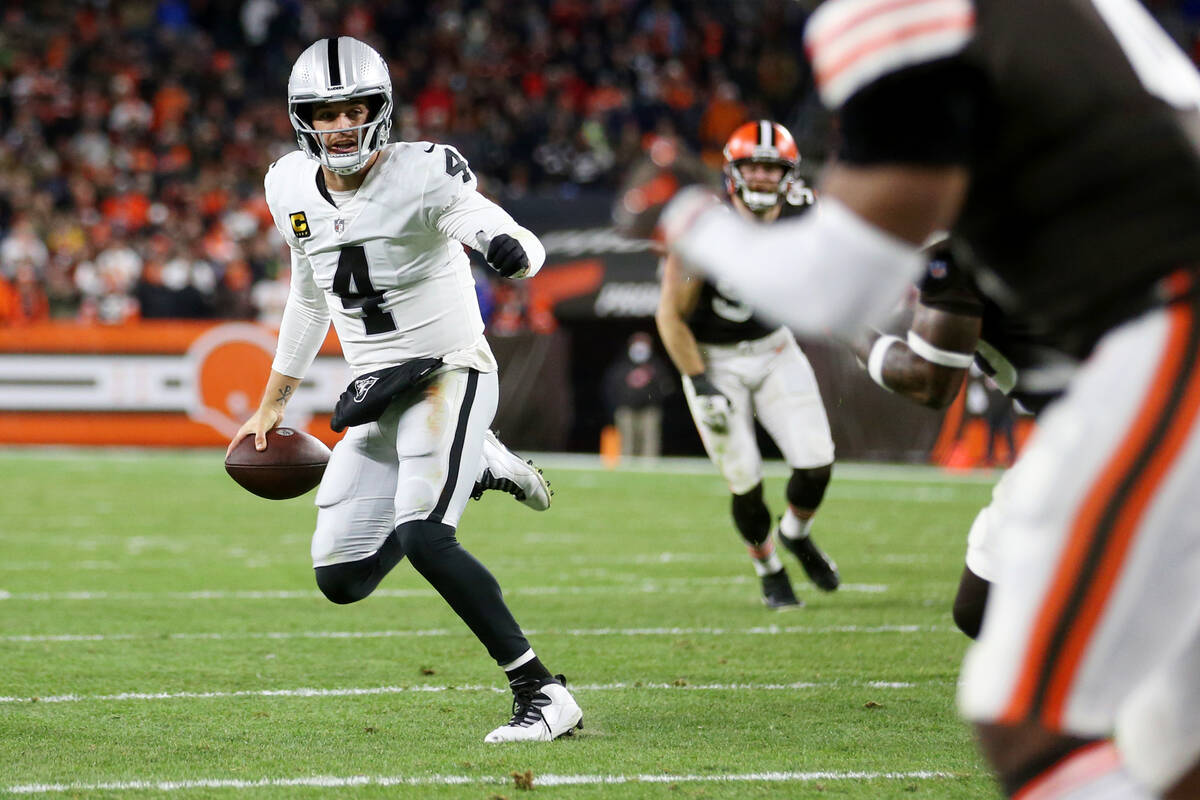 Raiders quarterback Derek Carr (4) looks for an open pass during the first half of an NFL footb ...