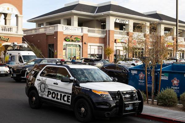 The Las Vegas Metropolitan police officer's vehicle is parked outside Shanghai Taste at 4255 Sp ...