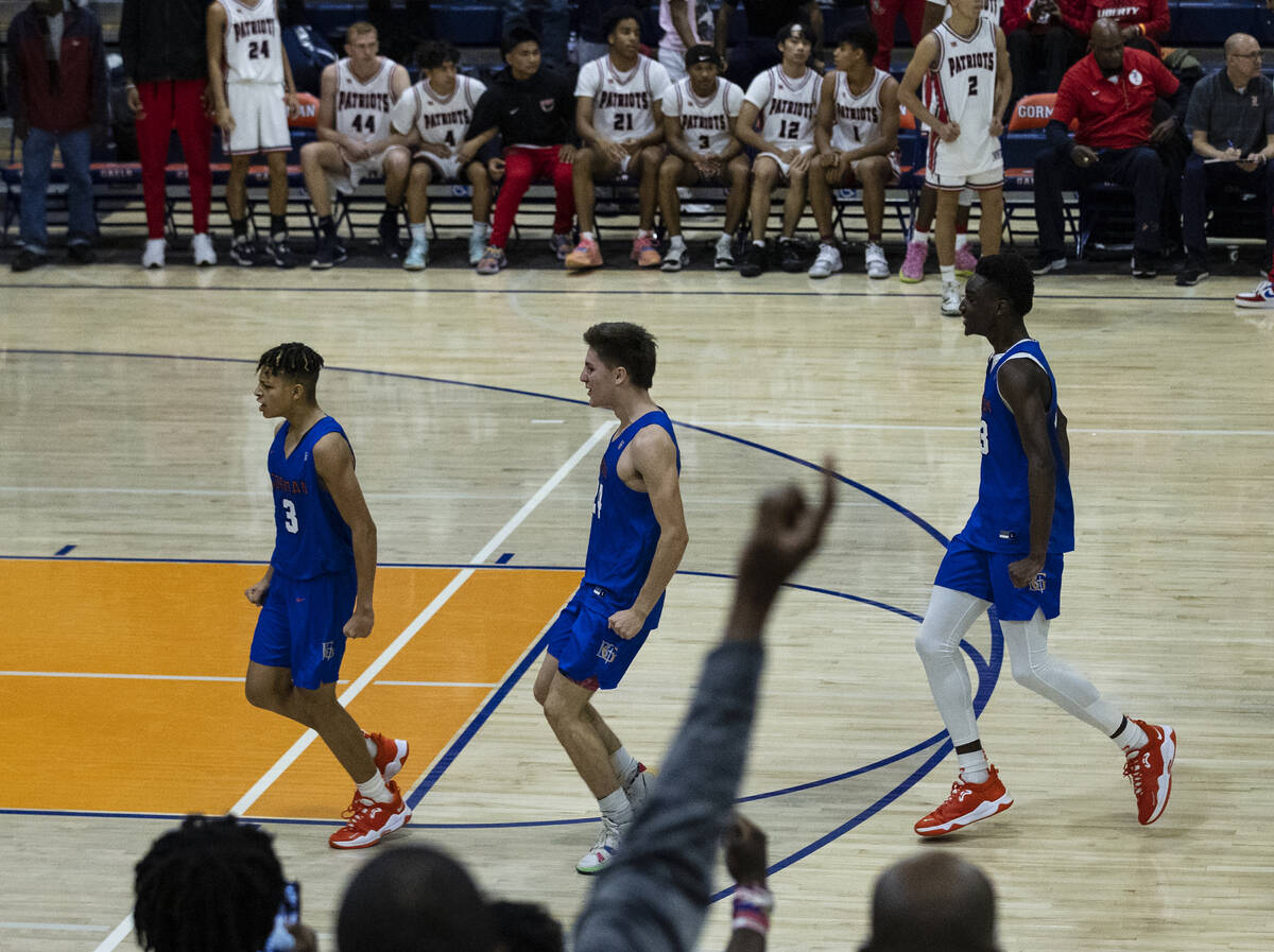 Bishop Gorman's John Mobley jr. (left) celebrates with his teammates after scoring the winning ...