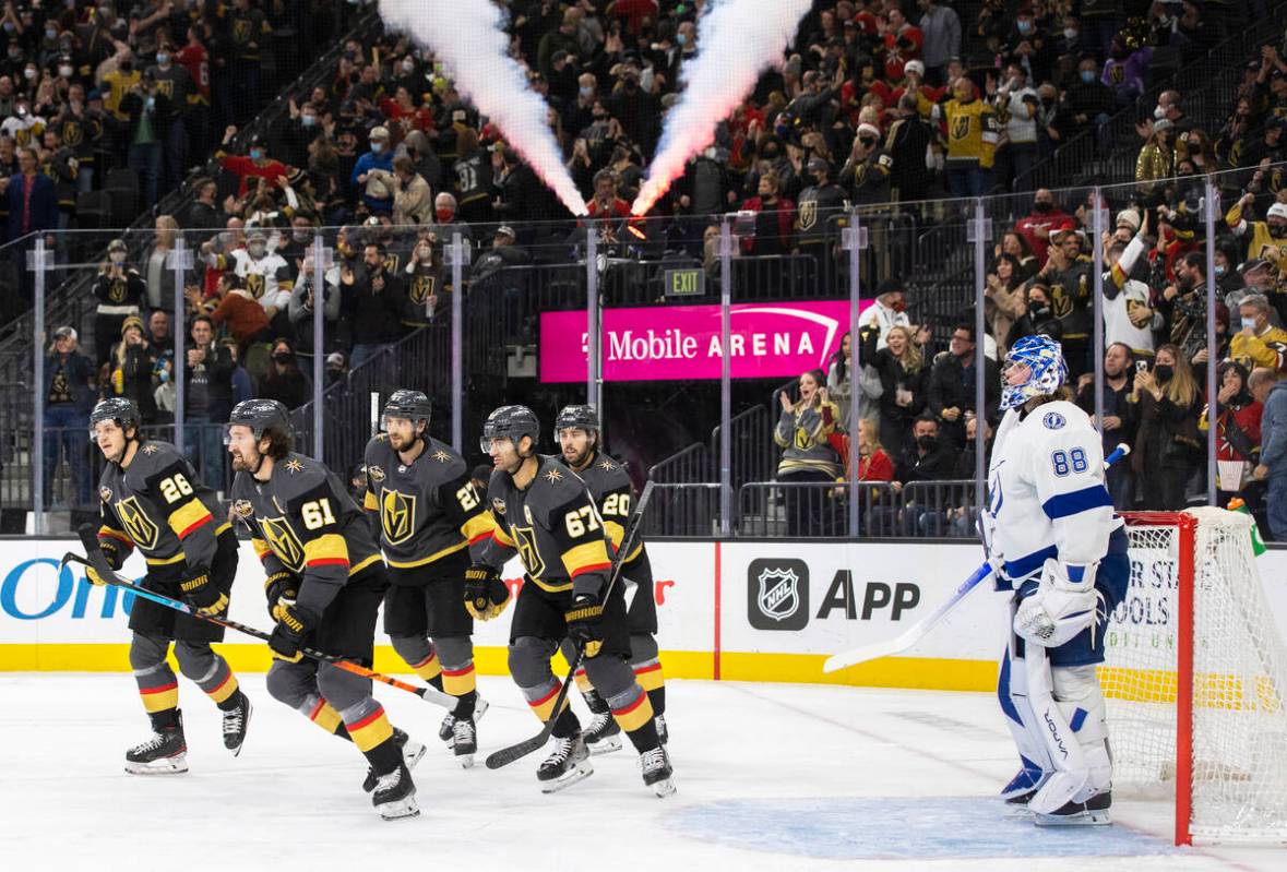 Vegas Golden Knights right wing Mark Stone (61) celebrates with teammates after scoring a goal ...