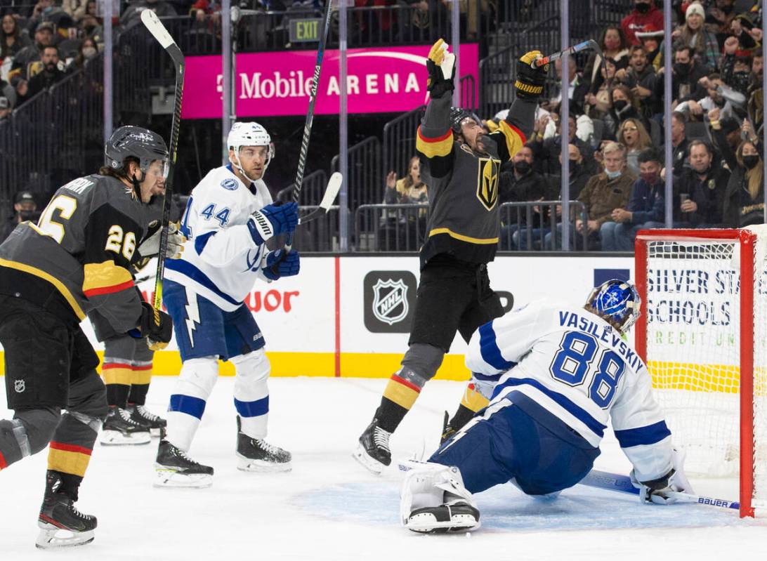 Vegas Golden Knights right wing Mark Stone (61) celebrates with teammates after scoring a goal ...