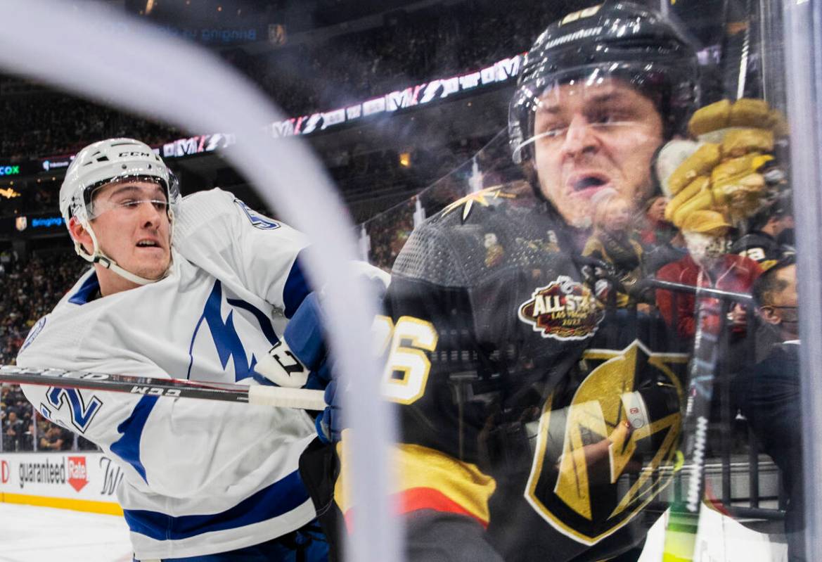 Tampa Bay Lightning defenseman Cal Foote (52) checks Vegas Golden Knights center Mattias Janmar ...