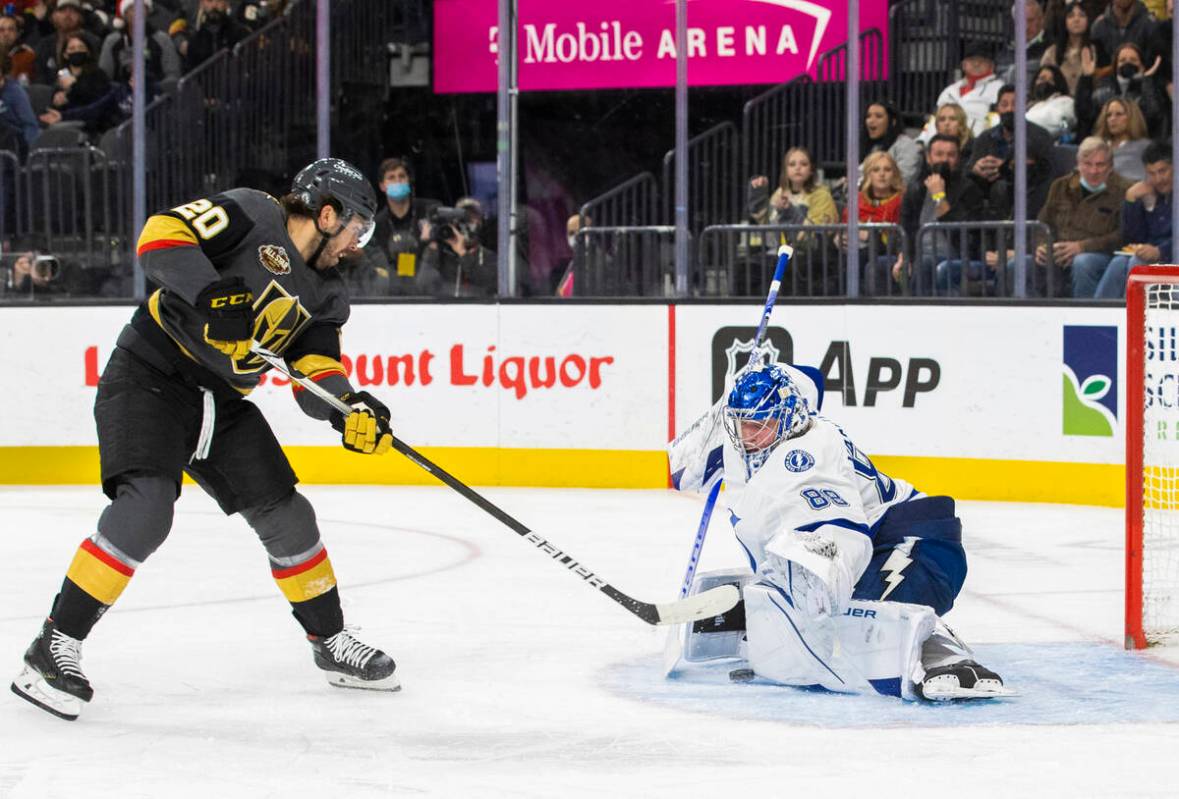 Vegas Golden Knights center Chandler Stephenson (20) shoots on Tampa Bay Lightning goaltender A ...