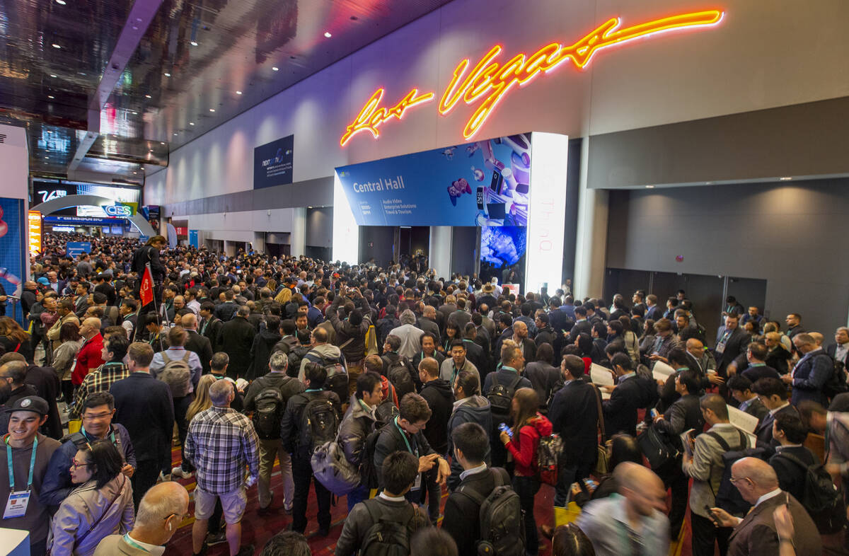 Attendees gather outside of the main entrance for Central Hall as CES Day 1 is about to open at ...