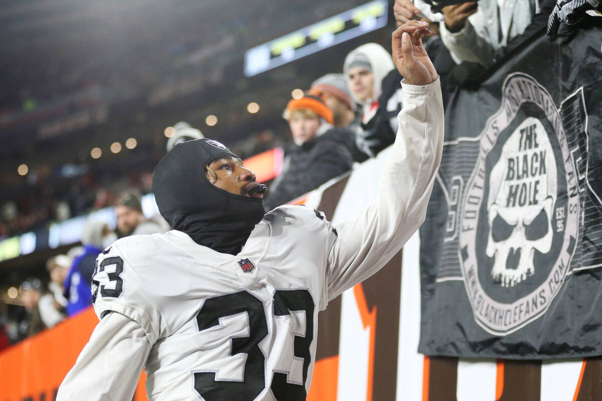 Raiders safety Roderic Teamer (33) celebrates his team's win win fans after an NFL football gam ...