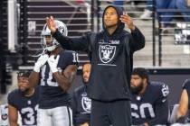 Raiders tight end Darren Waller (83) tries to get the crowd to make noise during the fourth qua ...
