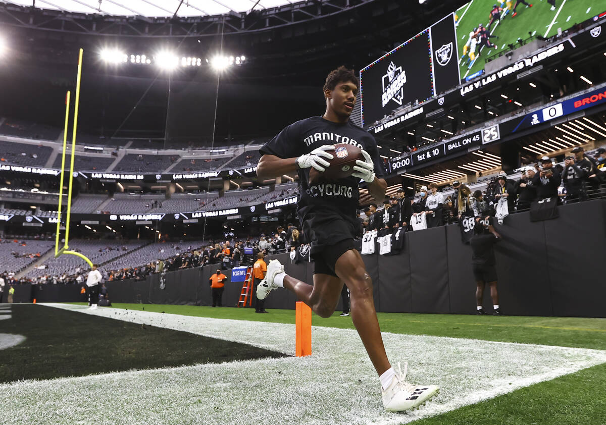 Raiders wide receiver Zay Jones (7) warms up before an NFL football game against the Denver Br ...