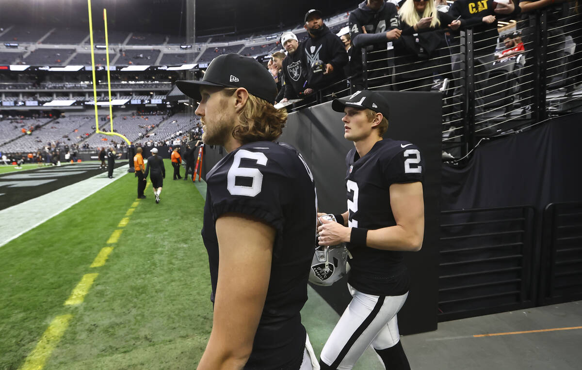 Raiders punter A.J. Cole (6) and kicker Daniel Carlson (2) walk onto the field before an NFL fo ...