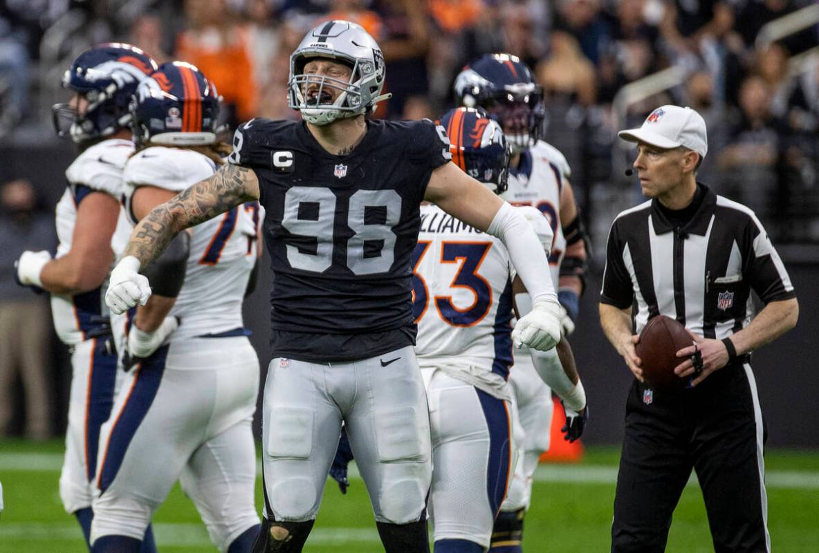 Raiders defensive end Maxx Crosby (98) celebrates a sack of Denver Broncos quarterback Drew Loc ...