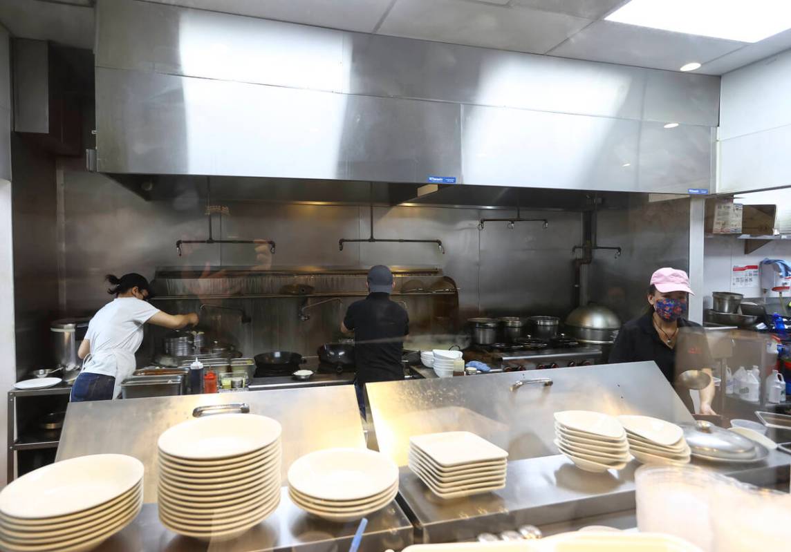 Employees cook food at ShangHai Taste in Chinatown's Shanghai Plaza in Las Vegas on Monday, Dec ...