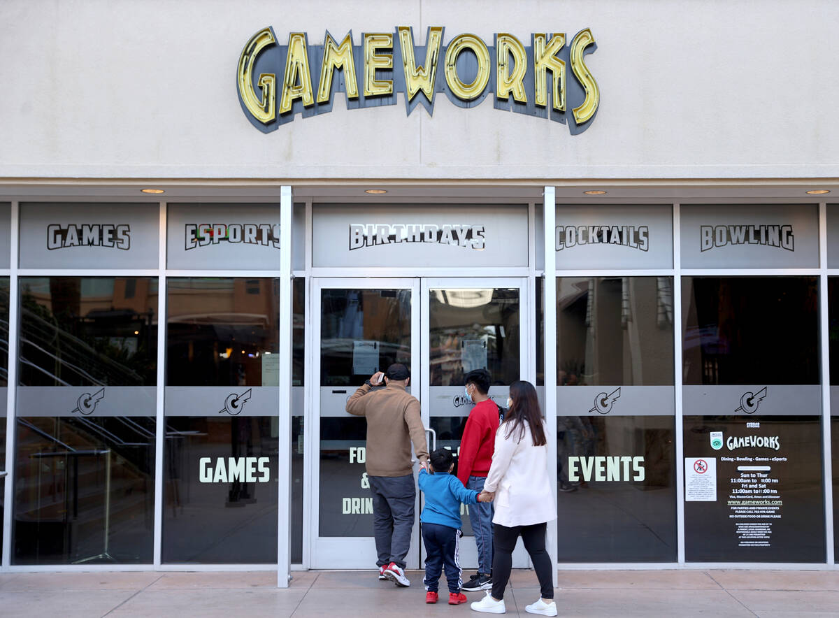 People check locked doors at the GameWorks location at the Town Square shopping mall in Las Veg ...