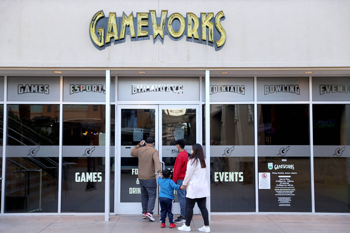 People check locked doors at the GameWorks location at the Town Square shopping mall in Las Veg ...