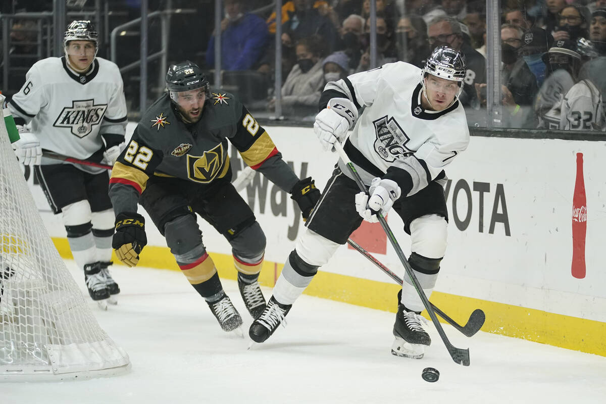 Los Angeles Kings defenseman Tobias Bjornfot (7) controls the puck ahead of Vegas Golden Knight ...