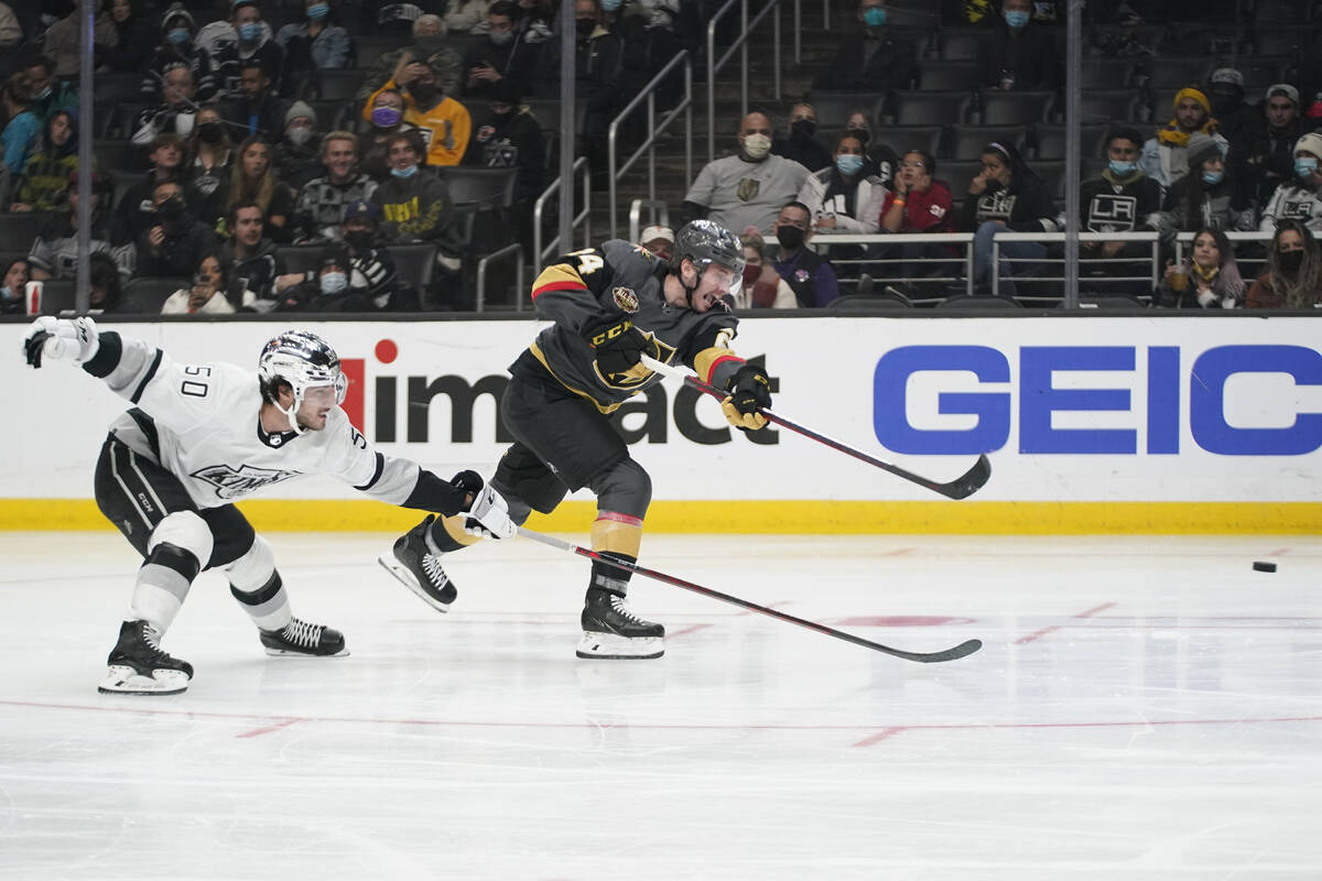 Vegas Golden Knights center Adam Brooks (24) shoots against Los Angeles Kings defenseman Sean D ...