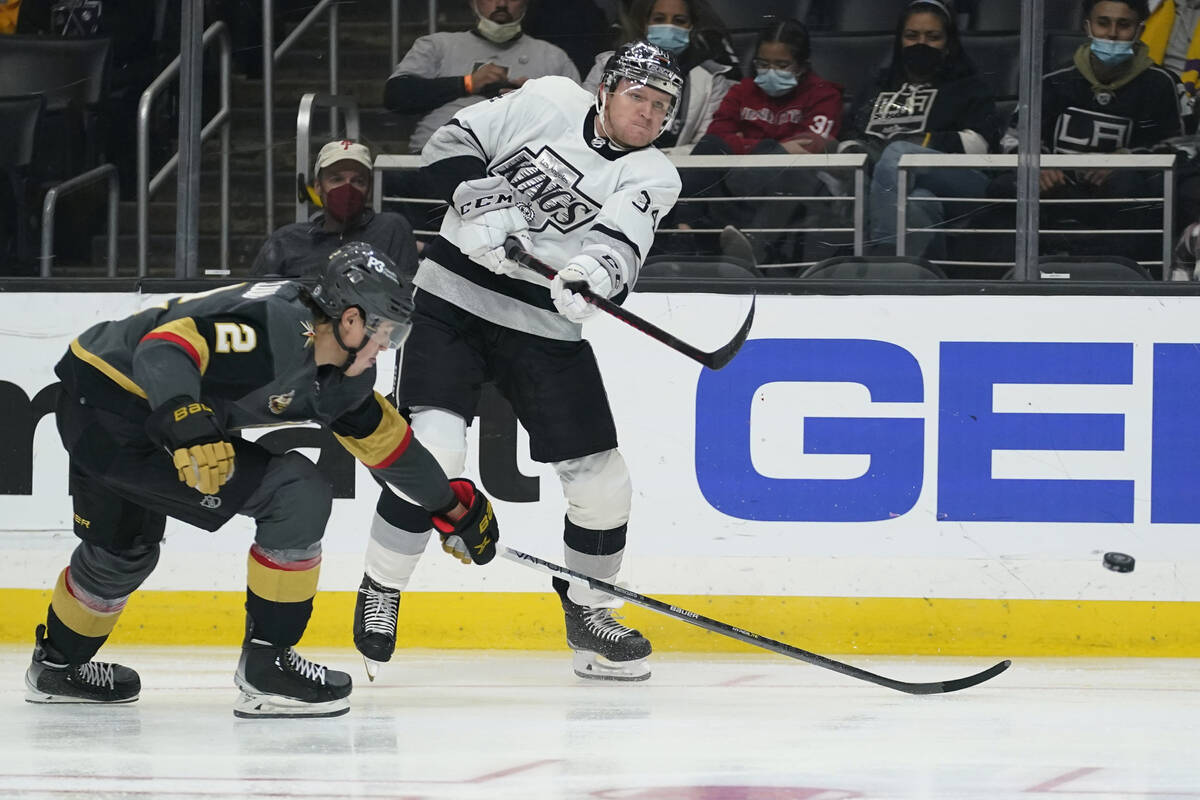 Los Angeles Kings right wing Arthur Kaliyev (34) shoots against Vegas Golden Knights defenseman ...