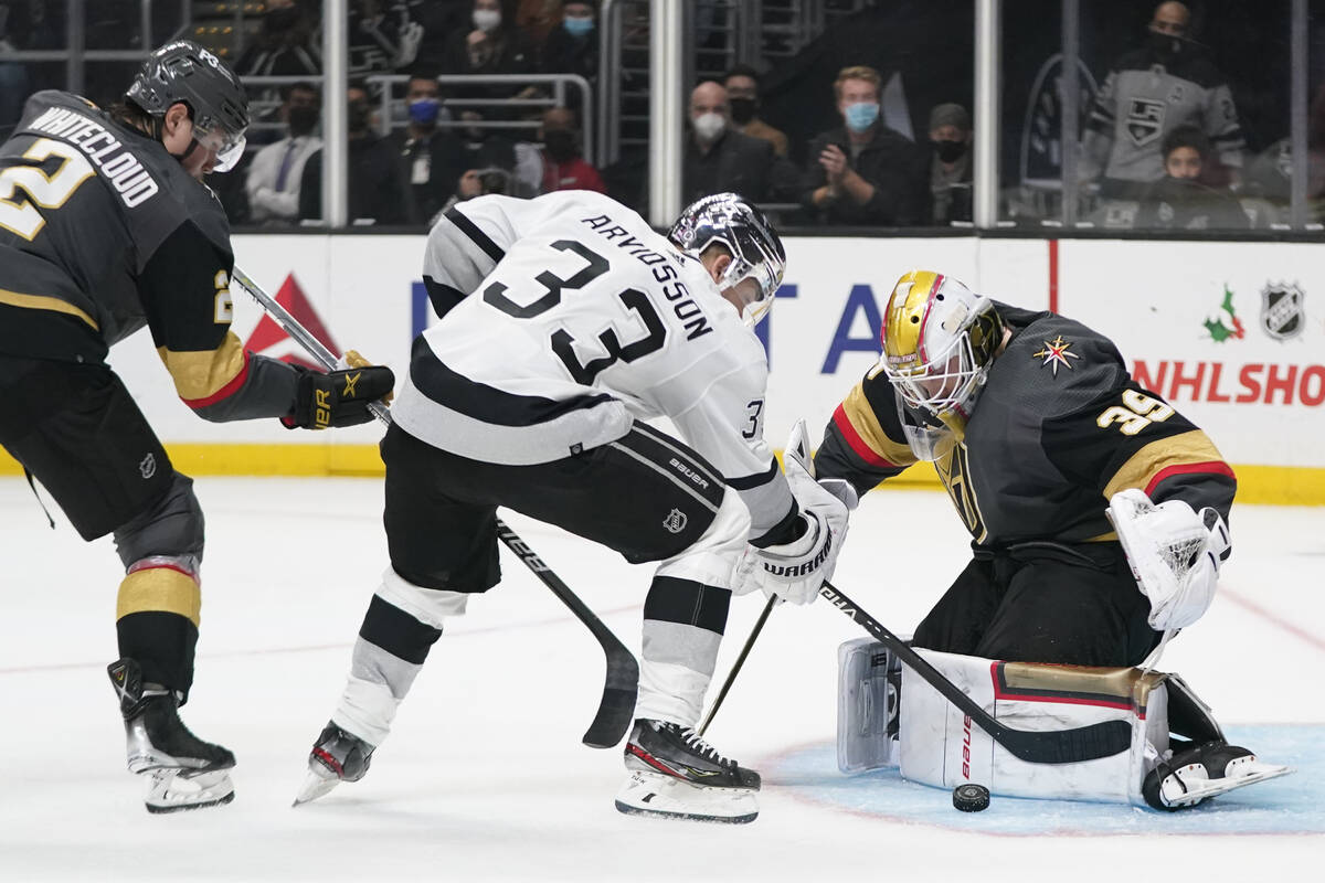 Vegas Golden Knights goaltender Laurent Brossoit (39) blocks a shot by Los Angeles Kings left w ...