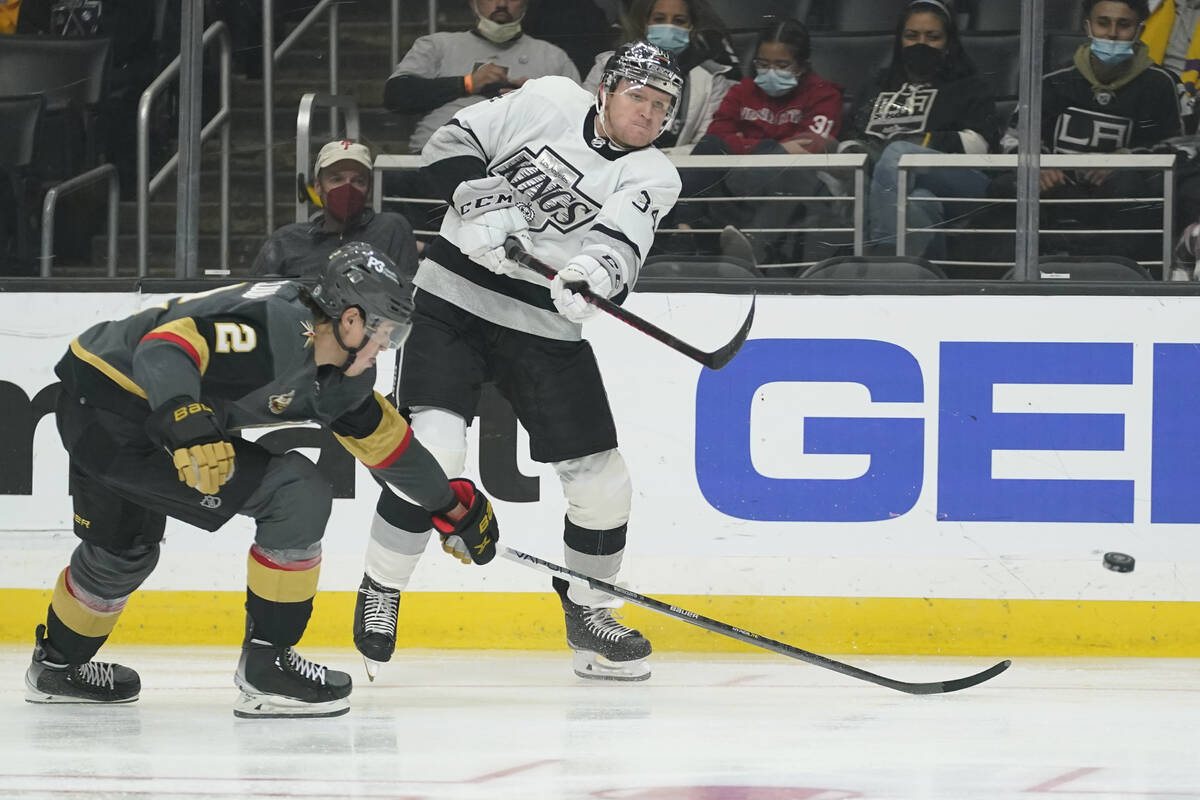 Los Angeles Kings right wing Arthur Kaliyev (34) shoots against Vegas Golden Knights defenseman ...