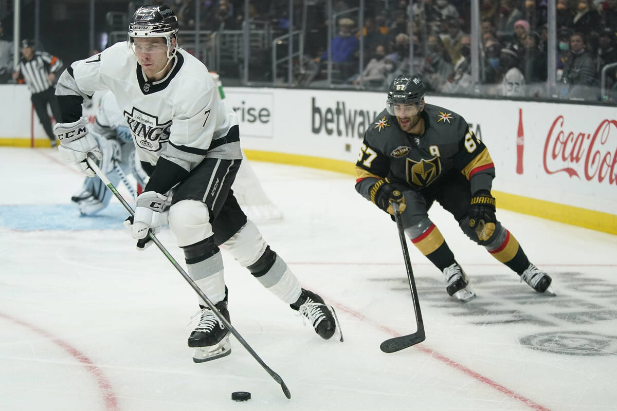 Los Angeles Kings defenseman Tobias Bjornfot (7) controls the puck against Vegas Golden Knights ...