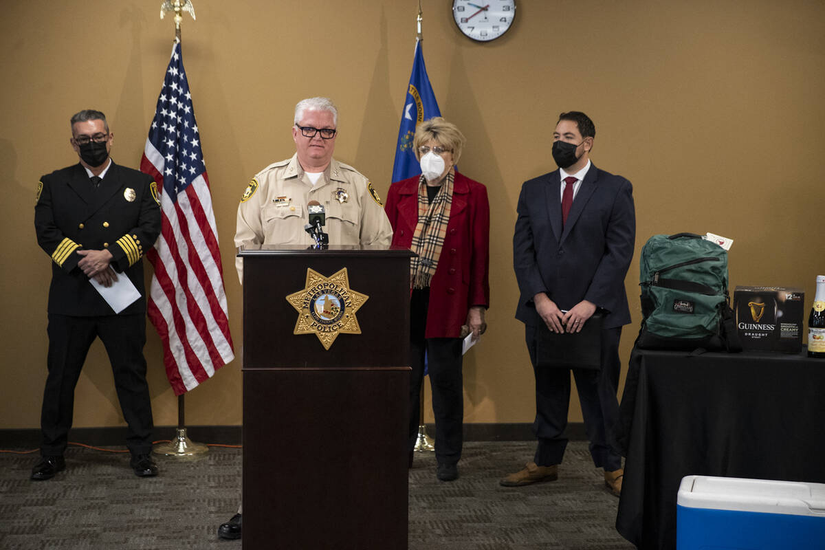 Undersheriff Christopher Darcy, second from left, with Clark County Deputy Fire Chief Warren Wh ...