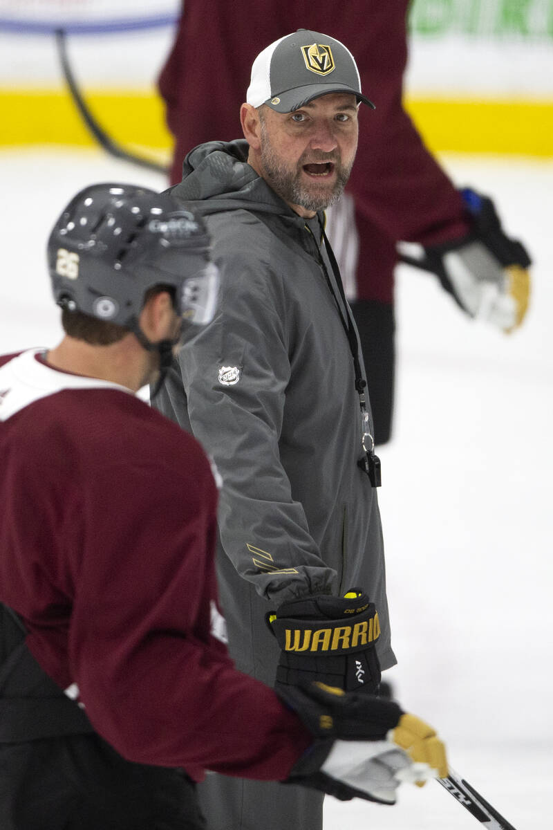 Golden Knights head coach Peter DeBoer communicates with players during a NHL hockey training c ...