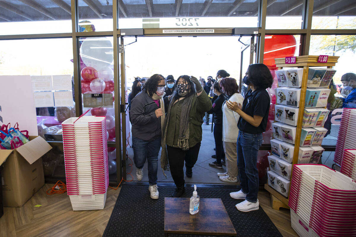 Jaxon Jones, left, and Christen Tranate take the first steps into Daiso, a popular Japanese dis ...