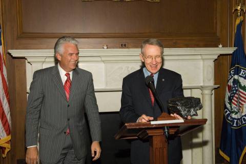 Sen. John Ensign, R-Nev., left, shares a laugh with Senate Majority Leader Harry Reid, D-Nev., ...