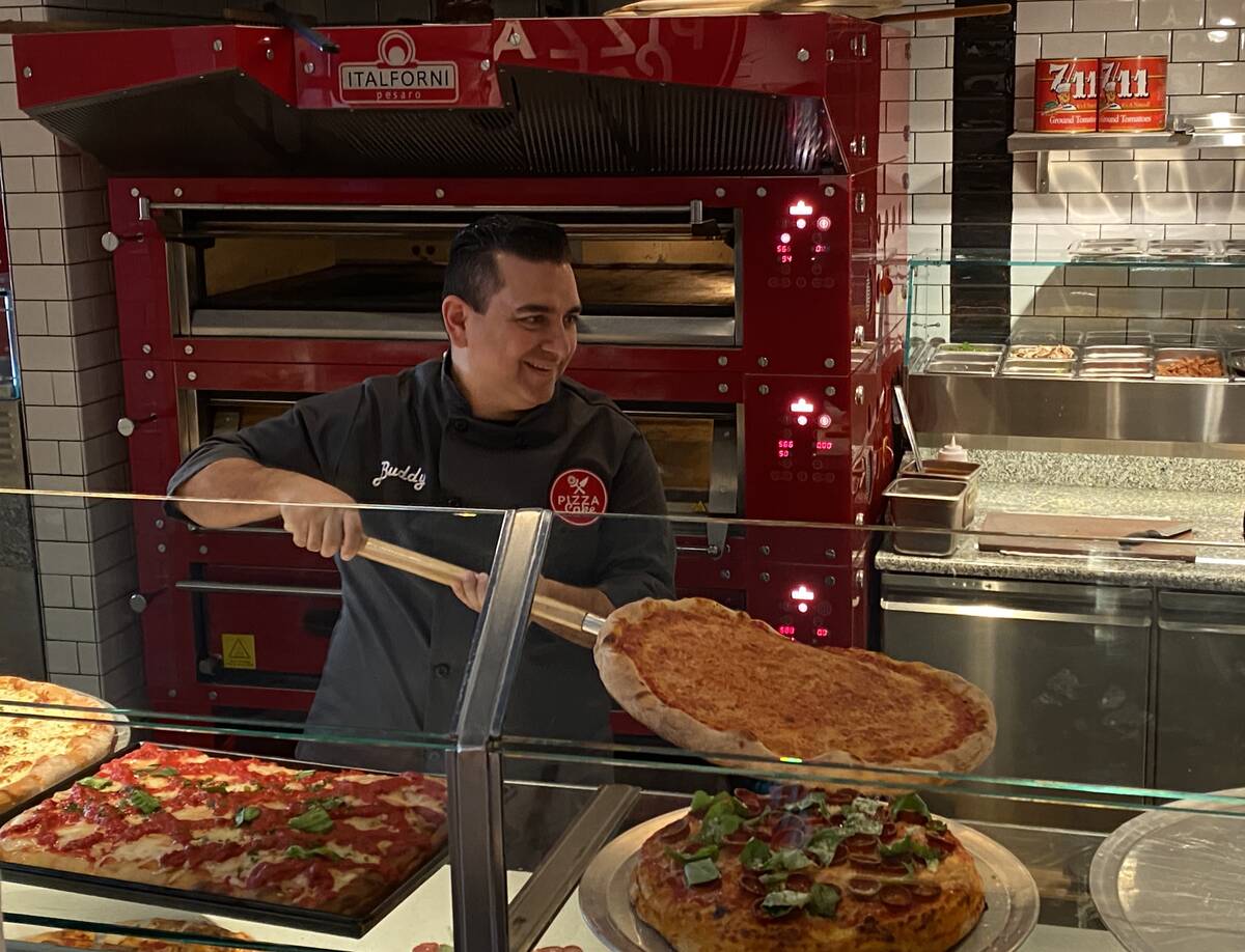 Buddy Valastro takes a pizza out of the oven at PizzaCake (Al Mancini/Las vegas Review-Journal)