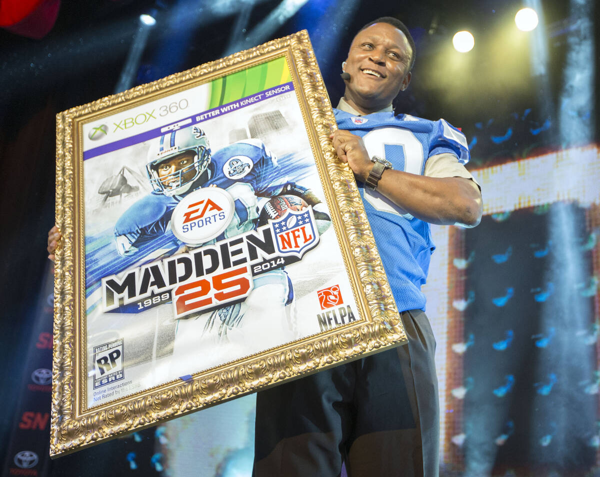 IMAGE DISTRIBUTED FOR EA SPORTS - NFL hall of fame running back Barry Sanders holds up a mock u ...